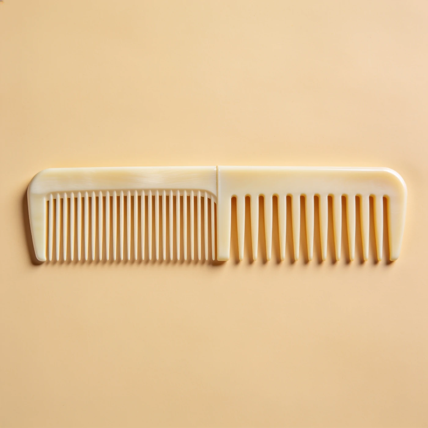 Dual Pitch Cutting Comb — ivory acetal; half fine teeth and half medium teeth; straight spine