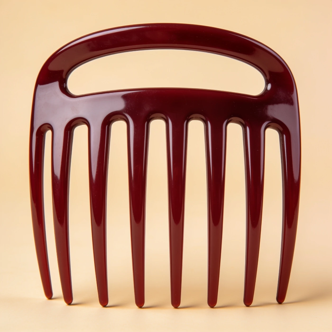 Lift Pick Comb — burgundy cellulose acetate; long parallel rounded prongs with short arched grip